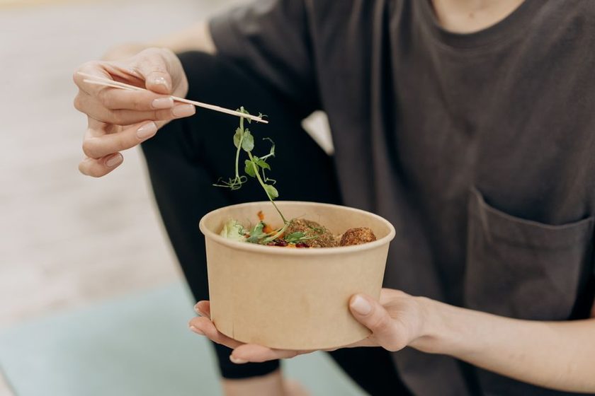 A person eating slowly at a calm, set table